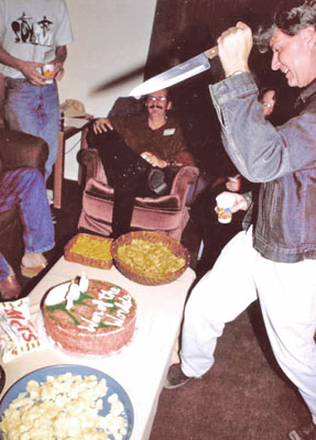 Uncle Wolfie wielding knife at the cake